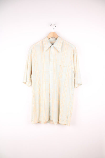 Cream, blue and orange tartan check shirt by Aristocrat Collection, with dagger collar, button closure, and a breast pocket. 