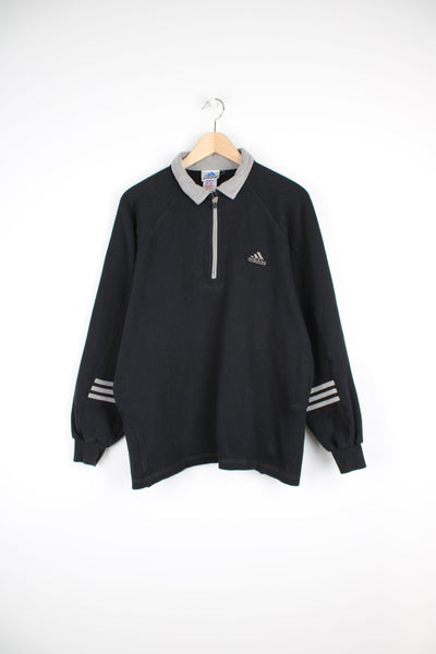 90's Adidas 1/4 zip polo style sweatshirt in black and grey, features embroidered logo on the chest